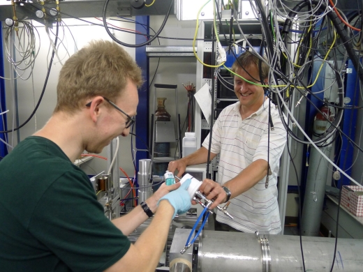 Dr. Paul Winkler and Paulus Bauer greasing the sampling port.